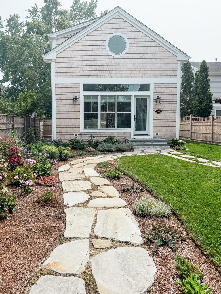 Coastal Cottage Renovation in Rhode Island w/ New England style - exterior stone walk way